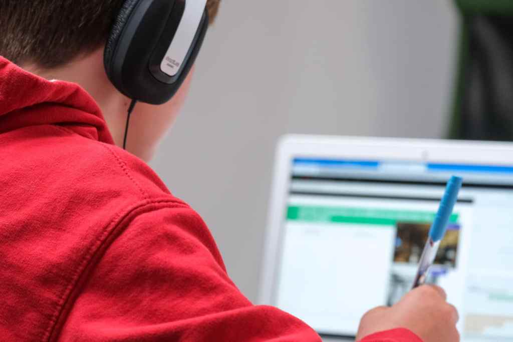 Male studying with headphones on