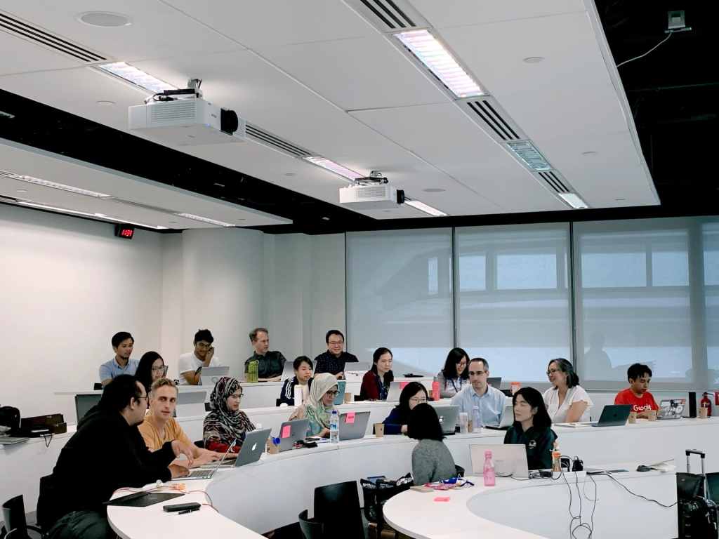 Students in a lecture hall with their laptops