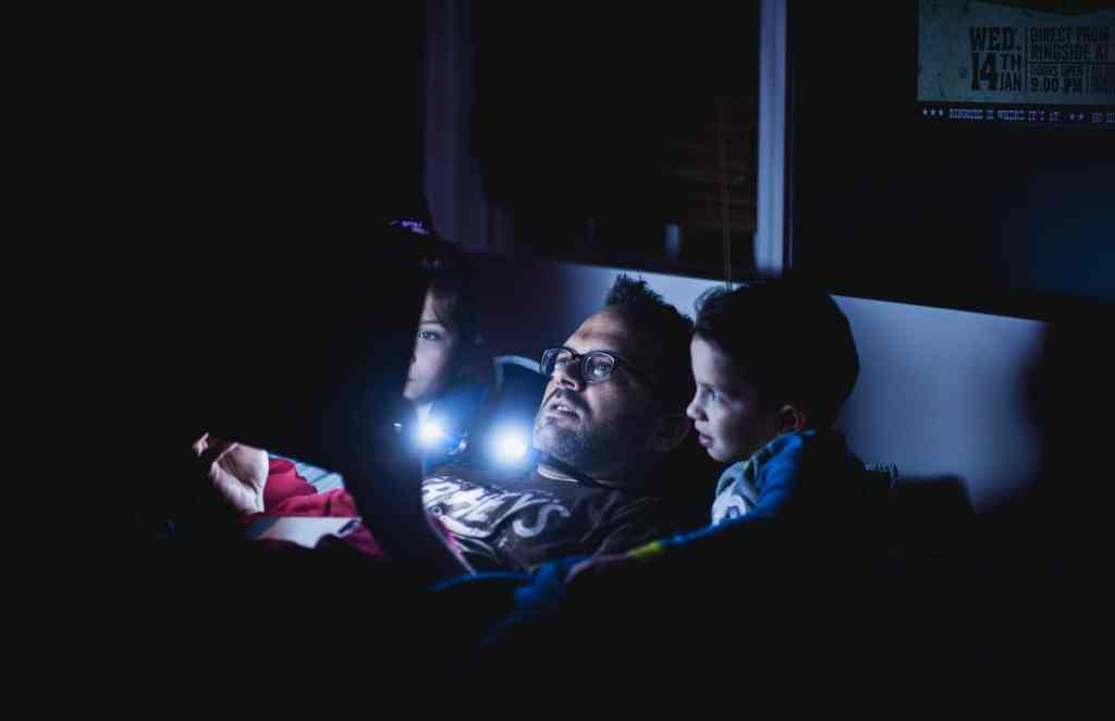 dad reading to his kids before bed