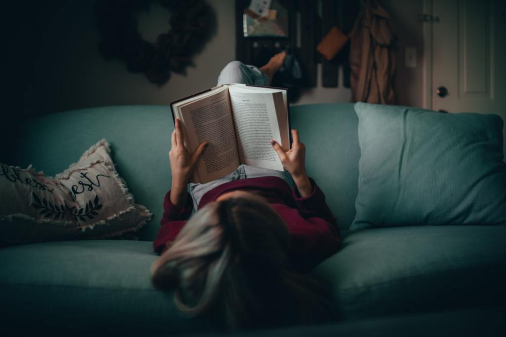 Analog activities - girl reading on a couch