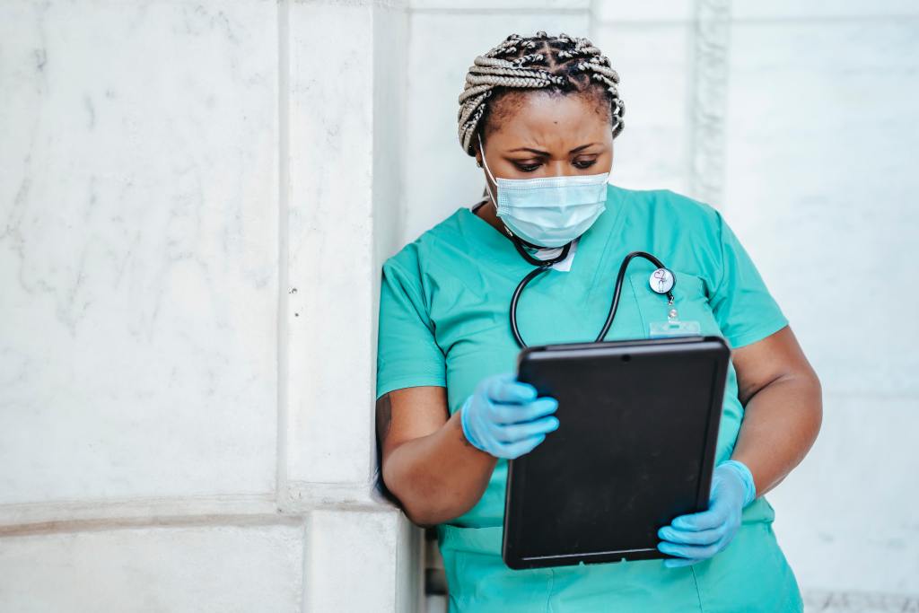 focused woman with documents in hopsital