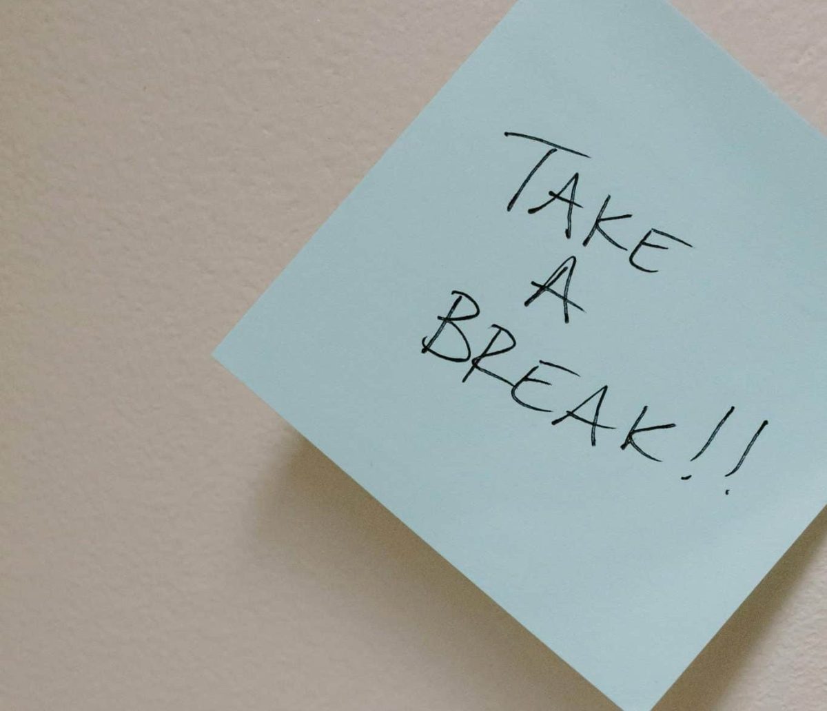 A blue sticky note with the text "TAKE A BREAK!" in bold, black lettering. A blue sticky note with the text "TAKE A BREAK!" in bold, black lettering.